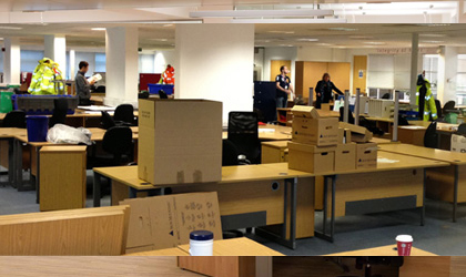 people trying to move all the boxes and unload in the office